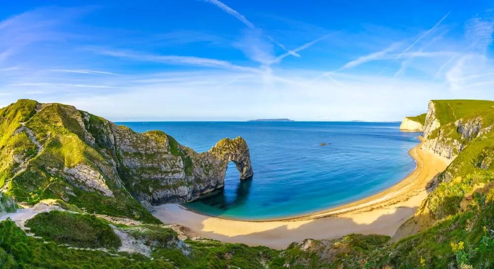 White beach and azure sea on the coast of England 